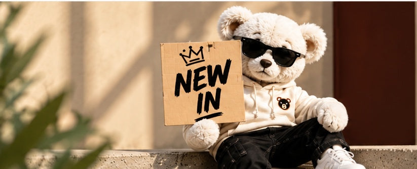 BEARION bear holding a New In sign